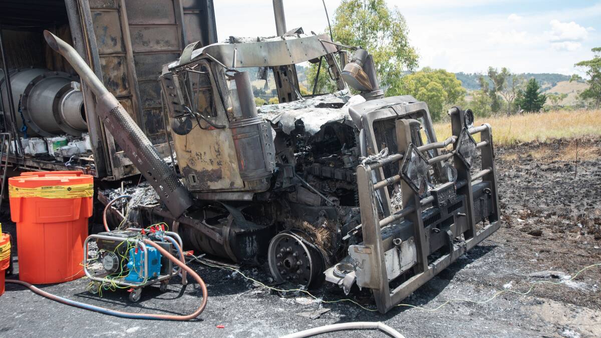 Crews cleaned up a chemical spill after a truck fire was contained. Pictures by Peter Hardin