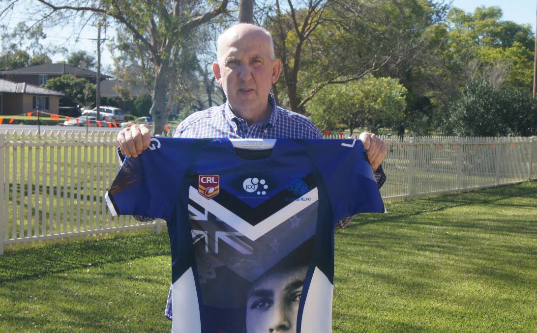 Tony Woodham, Moree Men of League president, pictured with one of the jerseys that will be auctioned off at Sunday's game. 