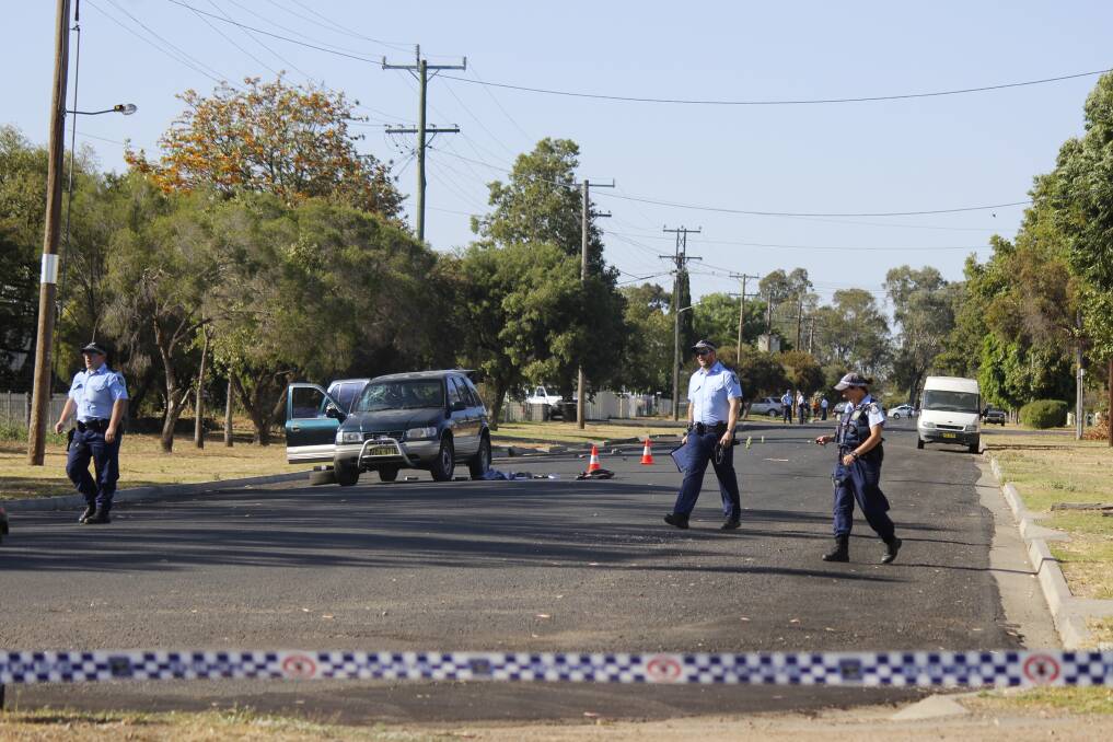 Crime scene: Police at the scene of the crash in Oak St, Moree, on the morning of October 20, 2015, which claimed the life of Wayne Hoyt. 