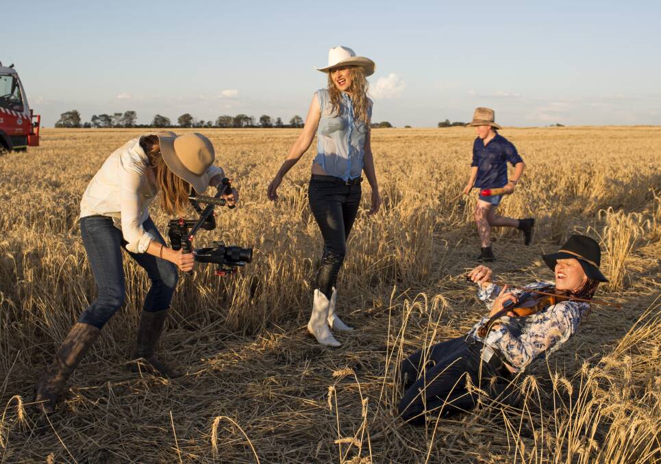 PROMOTING MOREE: Sascha Estens filming one of the scenes in her QantasLink My Town Spirit entry, featuring Merri-May Gill and Fi Claus. Photo: Bruce Tindale