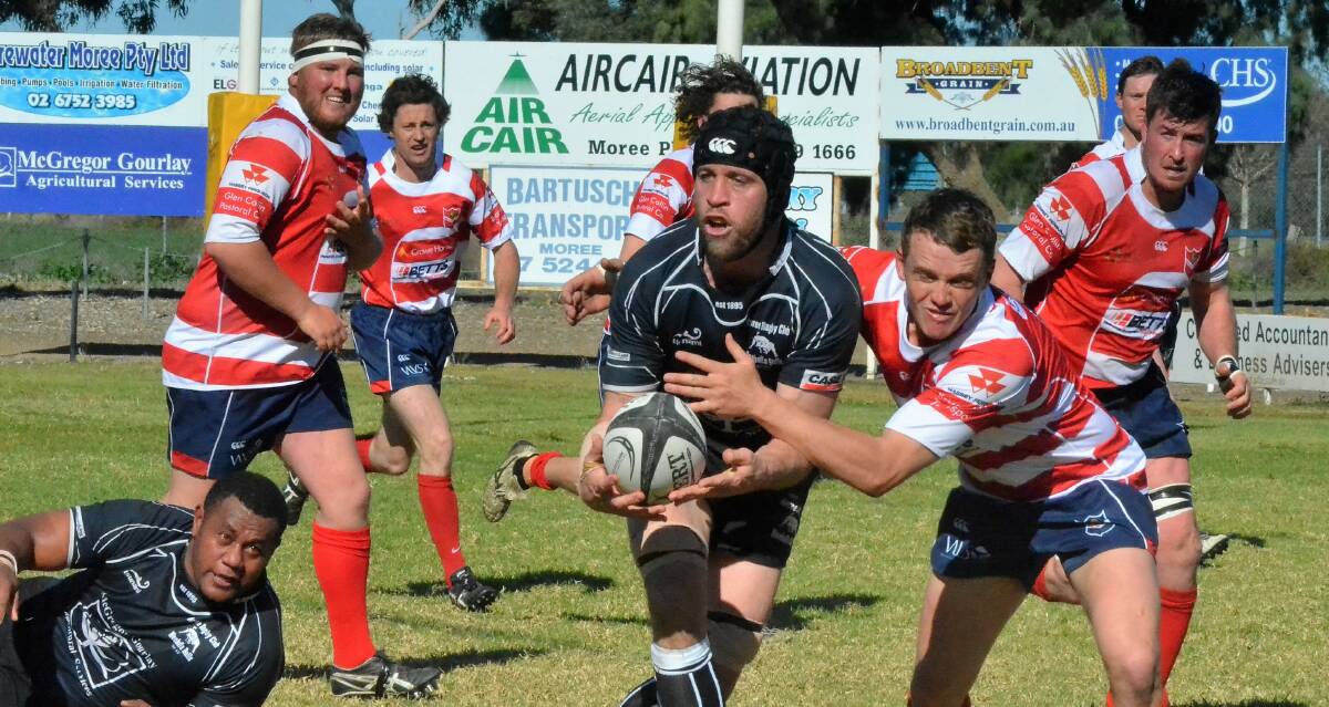 Moree Bulls coach Simon Hall looks to pass the ball during Sunday's semi-final clash against the Walcha Rams. The Bulls claimed victory 41-24 and now progress to the final.