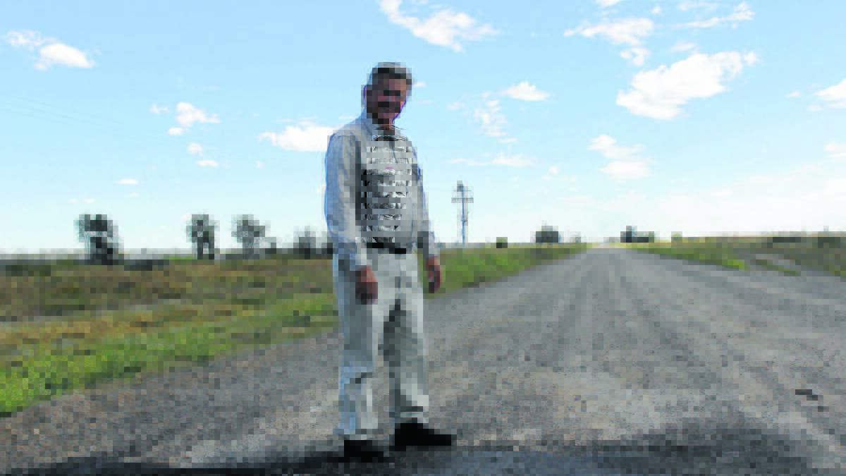 Moree Plains Shire councillors John Tramby pictured on an unsealed road back in 2015.