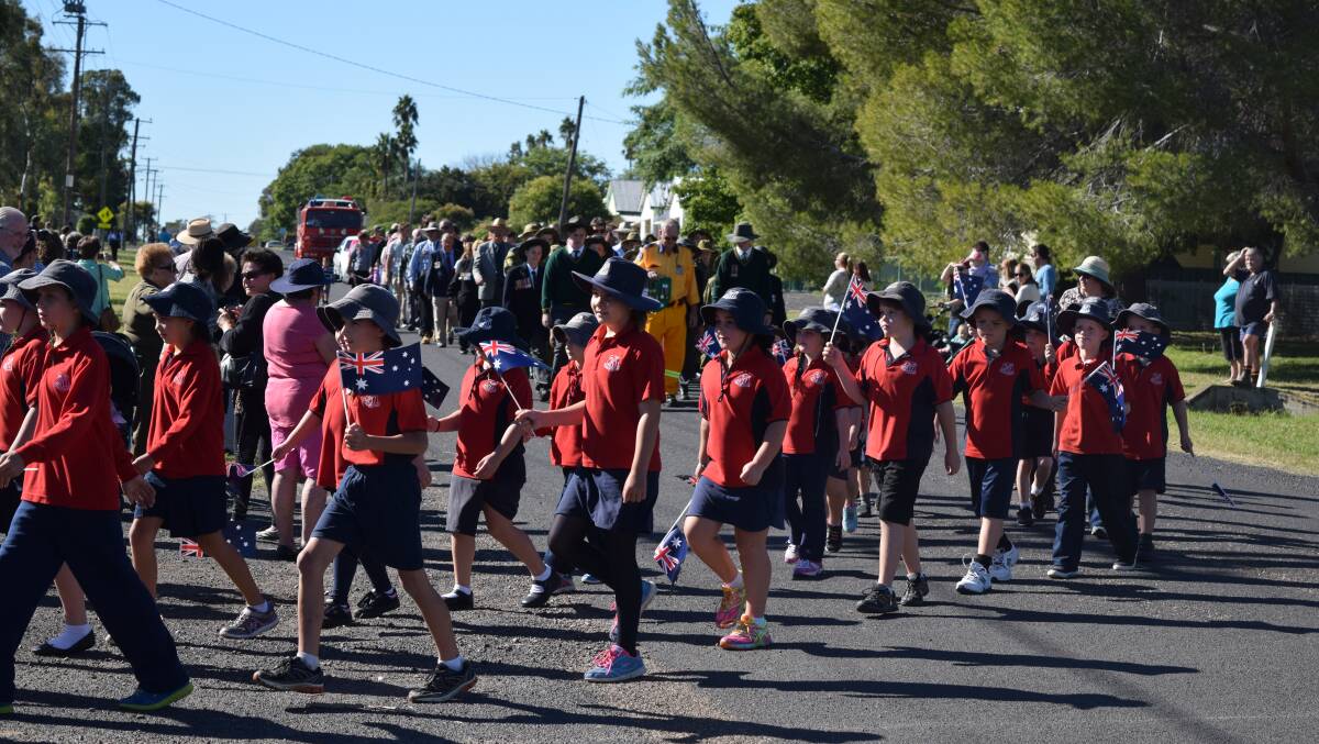 MARCHING: School students participate in the 2015 Anzac Day march in Pallamallawa.
