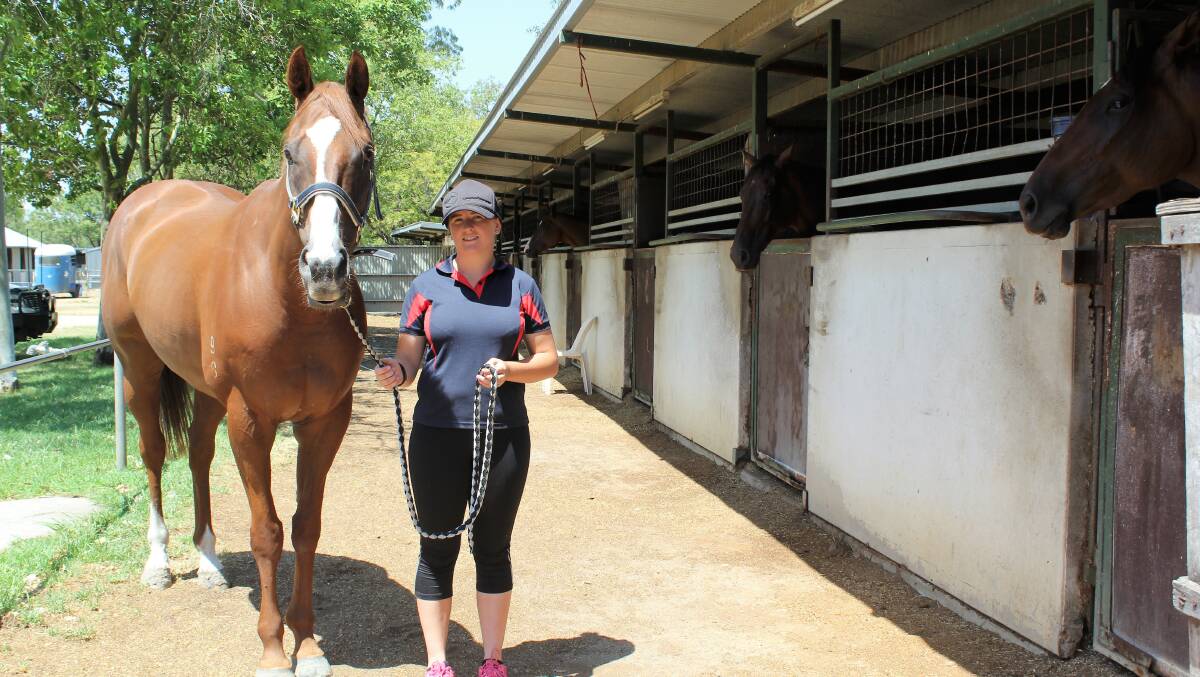IN WITH A CHANCE: Moree trainer Peter Sinclair's trackworker, Angela Taylor, with Arawak, who will compete in Saturday's feature race, the 1400m Pacific National Westpac Chopper Cup Benchmark 65 Handicap.