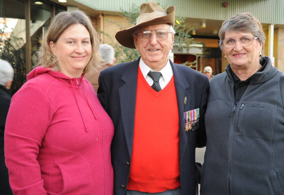 World War II veteran Alf Scott with his daughter and granddaughter during the 2015 Anzac Day service in Moree.