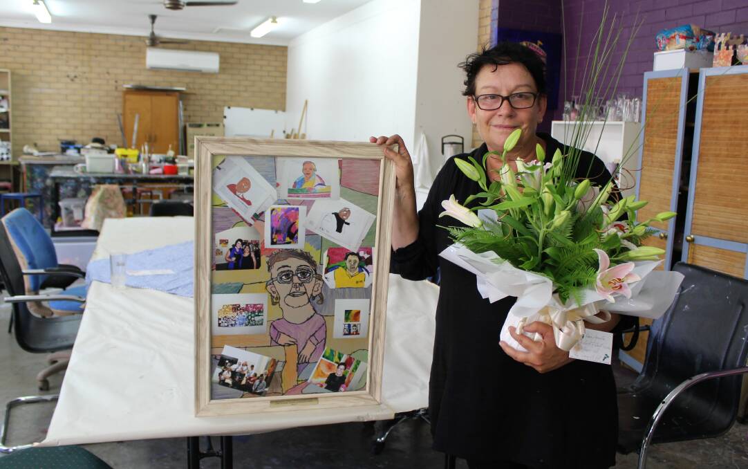 LAST DAY: Moree Plains Gallery education officer Janelle Boyd is pictured with her farewell gifts, including a beautiful artwork created by her Gwydir Industries students.