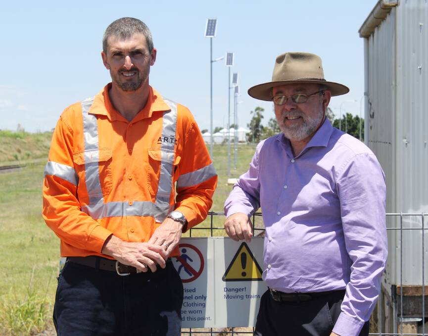 ARTC general manager asset delivery for the Hunter Valley, Scott Chapman and Moree Plains Shire Council director of planning and community development Angus Witherby check out the new solar-powered security lights which are being installed along the rail precinct this week.