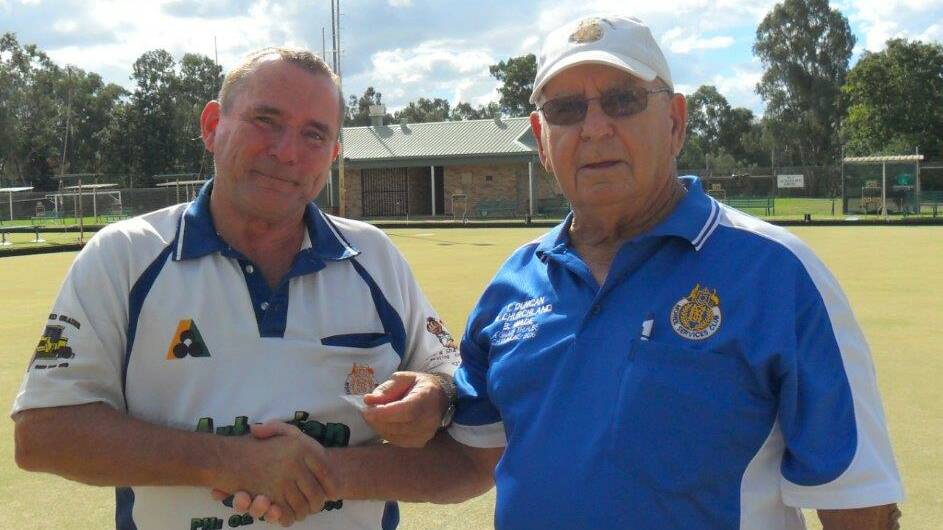 TOP DOG: Winner of the 2017 Gwydir District Singles Michael Ivanov being presented his winner's badge by Zone president Darcy Churchland.