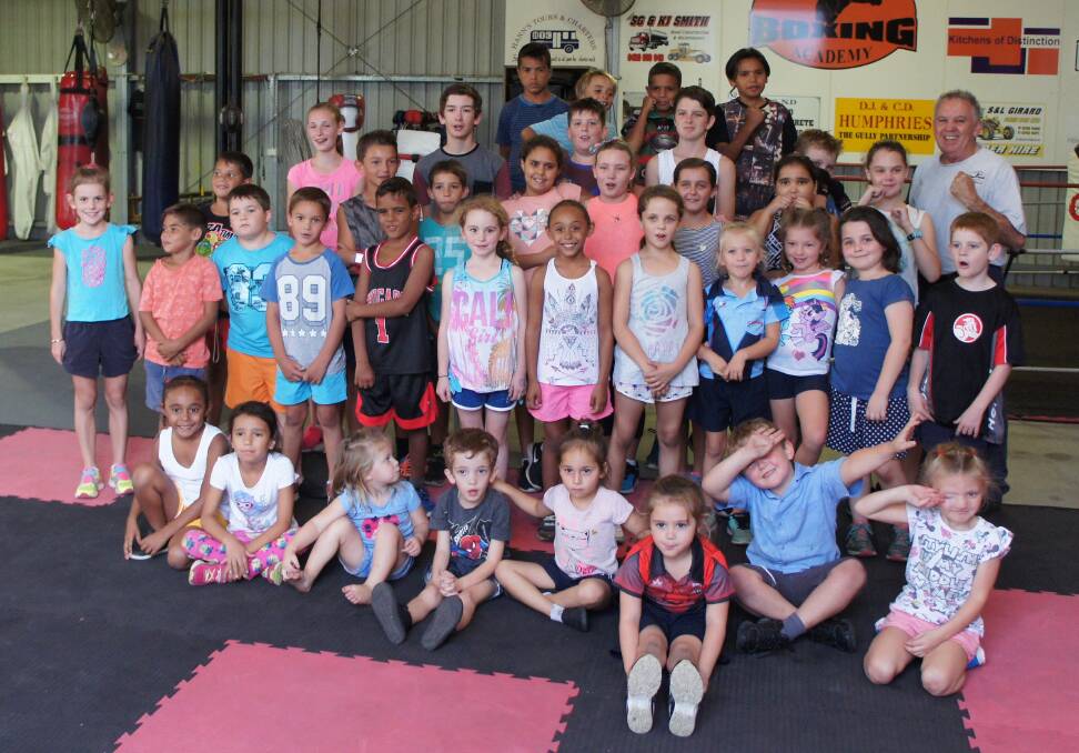 FUN AND FITNESS: Moree Boxing Academy instructor Colin 'Chalky' Rice (right) with the juniors who regularly participate in boxing classes.