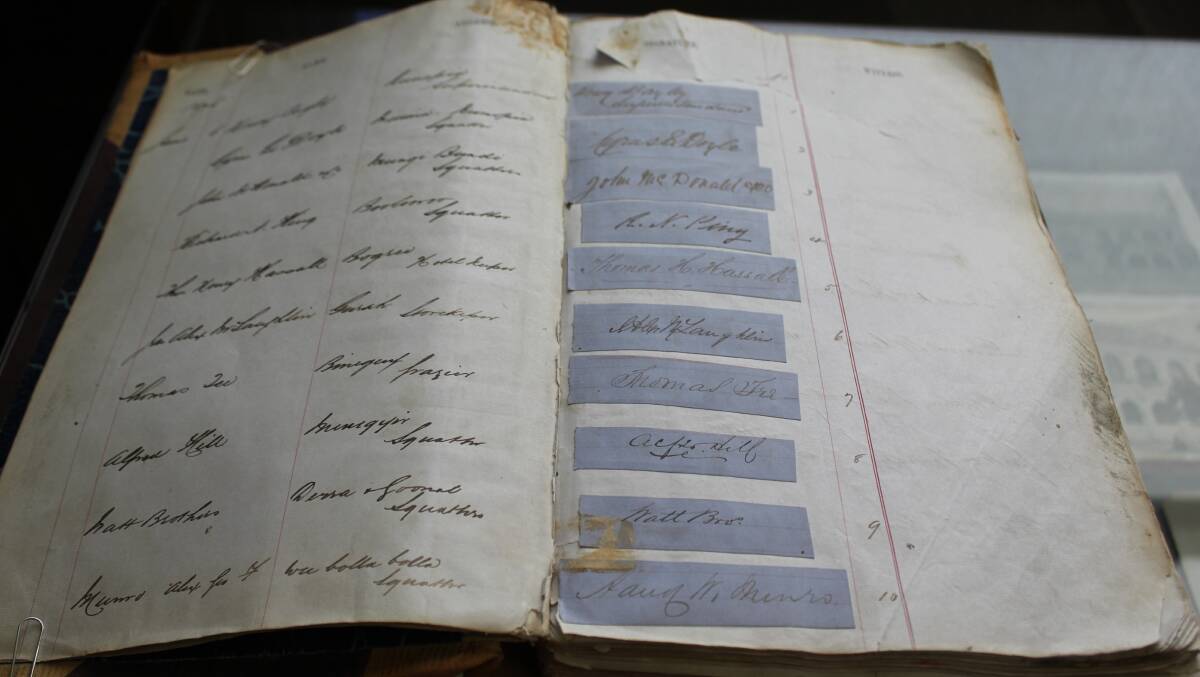 HISTORY: The old ledger from when the Moree branch opened in 1876, which includes the signatures of people whose family members are still clients today.