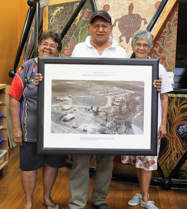 GET TOGETHER: Moree Mission School reunion organisers Marlene Weribone, Eddie Pitt and Edna Craigie look forward to catching up with their old classmates. They're holding a framed photo of the old school.