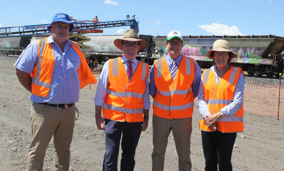 Broadbent Grain managing director Steve Broadbent, Northern Tablelands MP Adam Marshall, Parliamentary Secretary Kevin Anderson and councillor Sue Price with the train. 