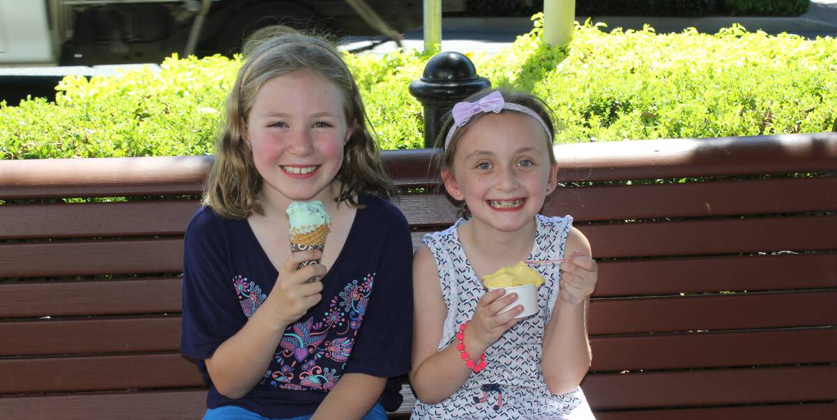 IN CASE OF EMERGENCY: Ice creams provide quick relief from the heat for Maddie Lumb, left and Amelia Powlton. Curry can also help cool the body since the spices make us perspire, cooling the body when it evaporates. 