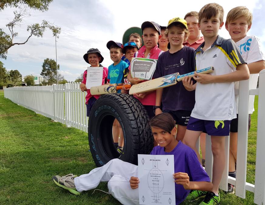 WORTHY CAUSE: Moree Junior Cricket Club members with some of the raffle and auction items up for grabs on Friday night. 