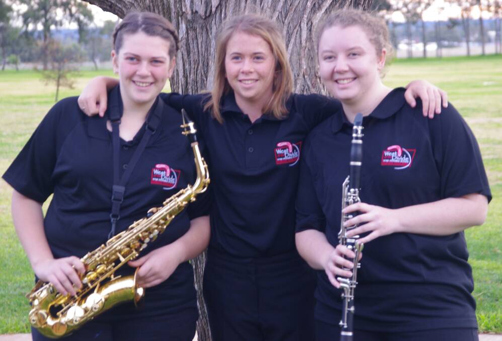 On song: Packing their bags for Europe are Warialda High students, from left, Louisa Gilmour, Keziah McIntosh and Beatrice Waller.