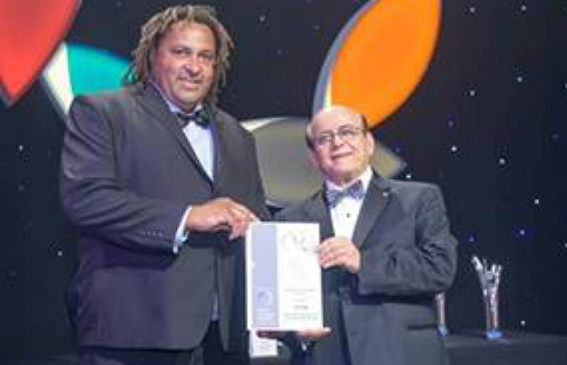 RECOGNITION: Mick Davis receiving the finalist certificate at the 2014 Ethnic Business Awards. Photo contributed