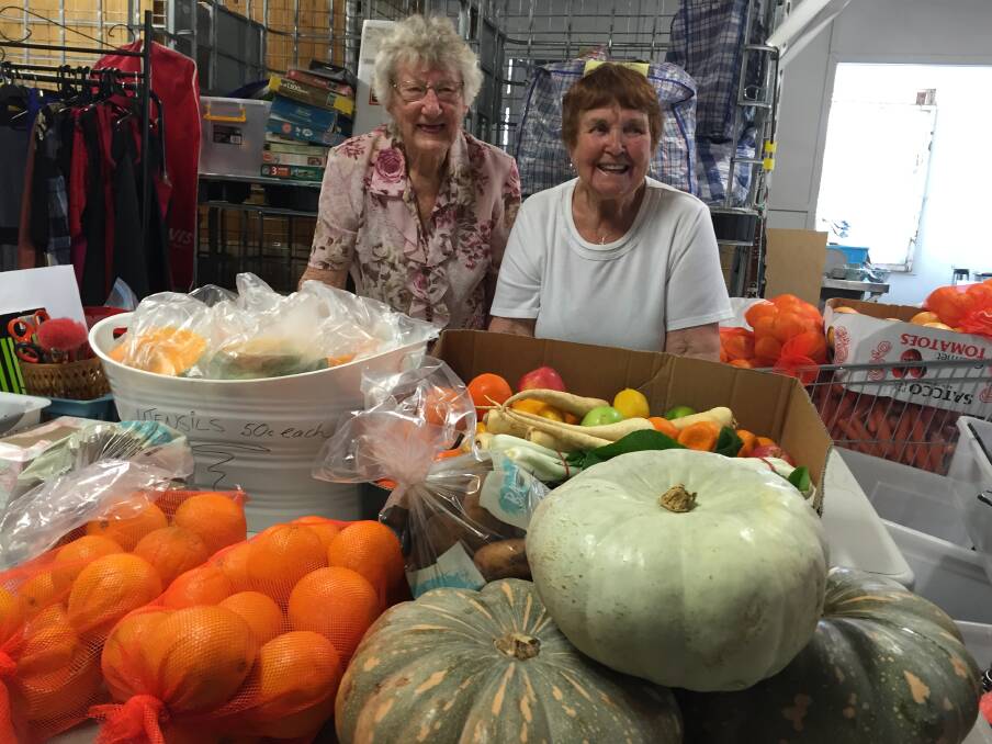 April Ireland and Shirley Jackson sort the fruit and vegetables each week.