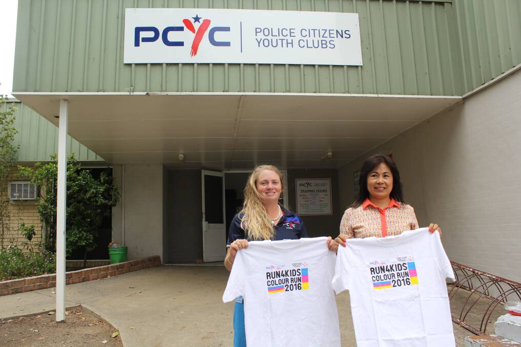 Good cause: Moree PCYC's Tayla Macey and Malou Deakin with the donated shirts.