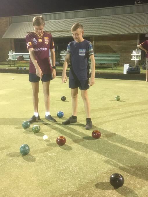 It was me: Jacob 'Tackle' Berry and Brock 'Zero 5' Heffernan trying to determine who has the winning shot. Both bowlers were very close. Photos: Supplied.