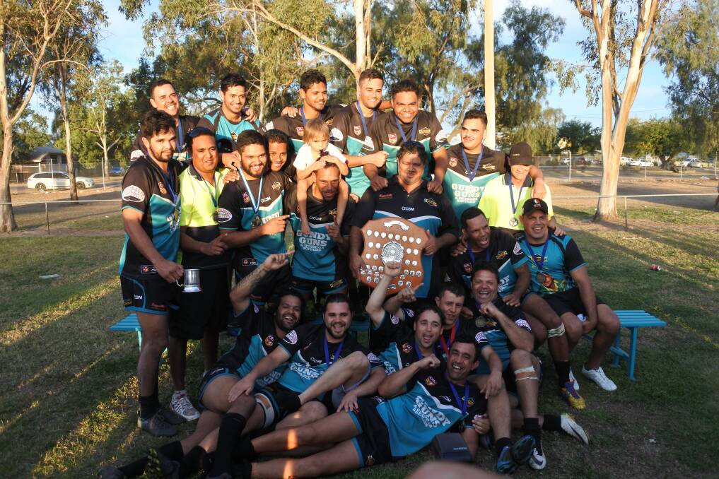 Proud as punch: The 2017 Group 19 first grade premier,s Macintyre Warriors, hold the shield after their stellar win in Boggabilla on Saturday.