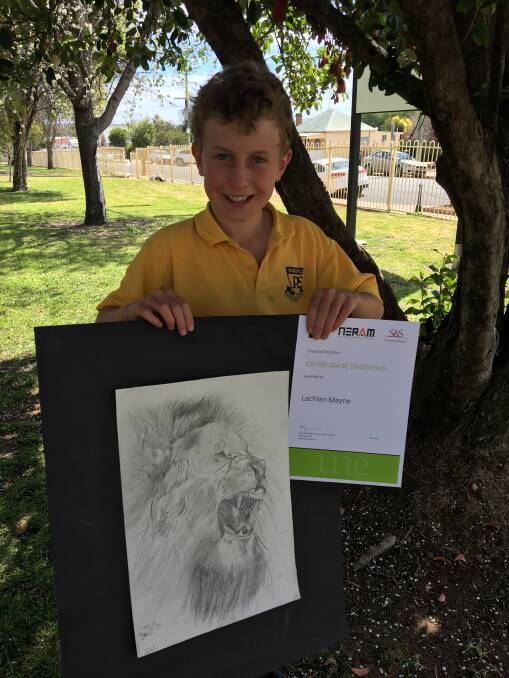 Local artist: Lachlan Mayne proudly holds his sketch of a lion's head and a certificate of distinction from University of New England's School of Education and the New England Regional Art Museum.