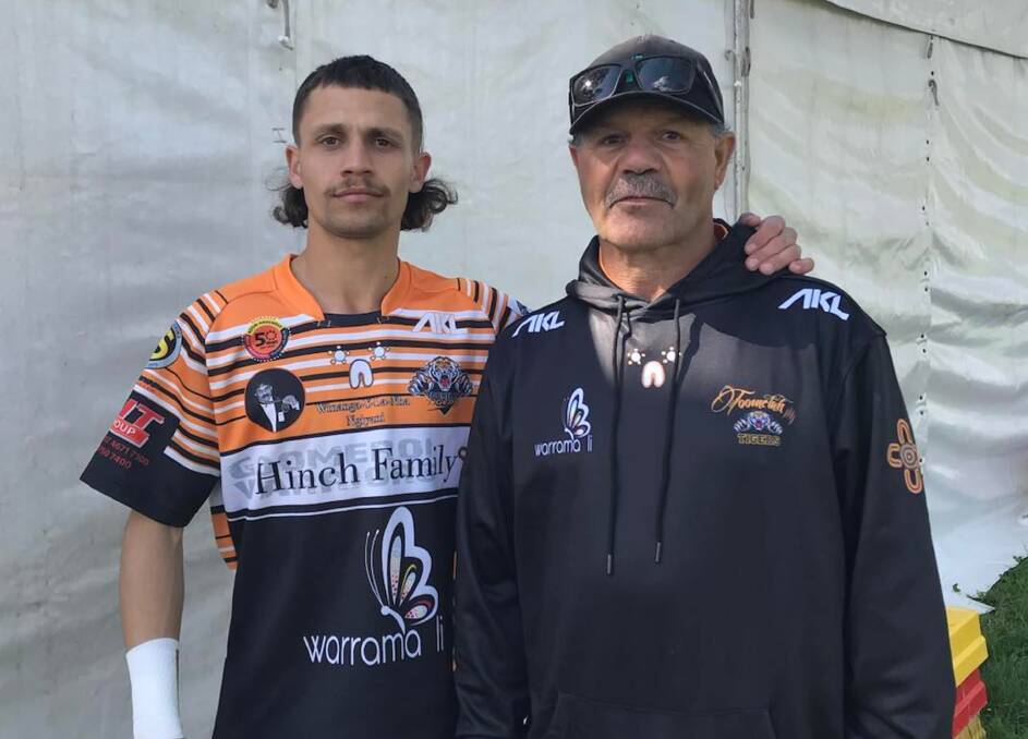 Lachie McGrady with his father, Barry, who won a premiership with the Moree Boars during his playing days. Picture supplied.