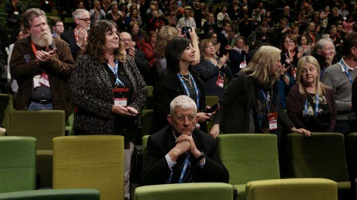 Union figure and same-sex marriage opponent Joe de Bruyn remains seated while Senator Wong is given a standing ovation. Photo: Andrew Meares