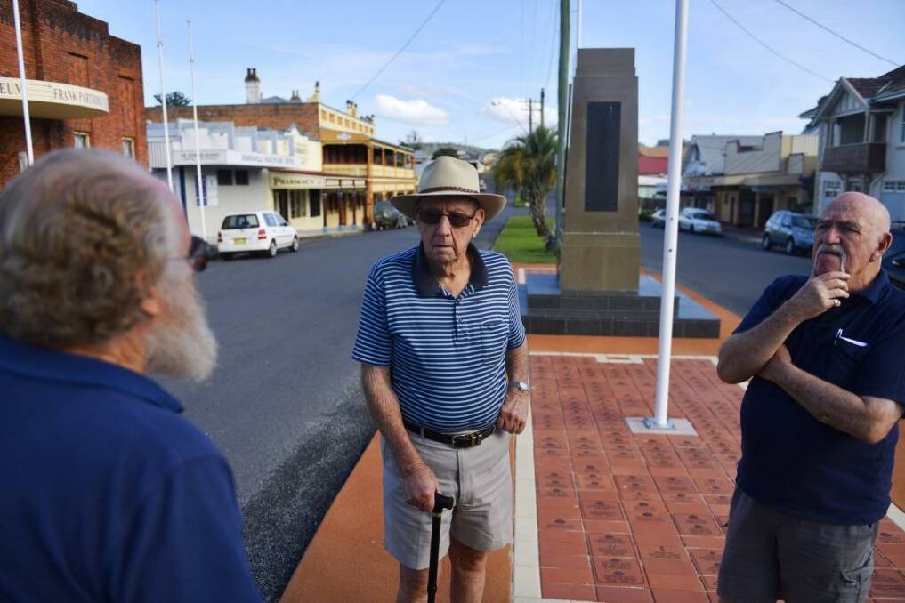 Veterans Blue Manning, Kevin Newman and Graham Allen at the Bowraville Cenotaph, one of the region's first memorials. Photo: Nick Moir
