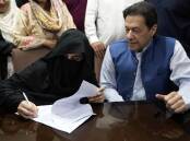 Bushra Bibi (left) has been under house arrest at husband Imran Khan's Pakistan home since January. (AP PHOTO)