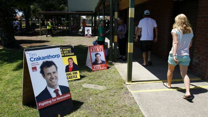 Decision time: Voters arrive at Stockton Public School to vote in the Newcastle byelection. Photo: Max Mason-Hubers
