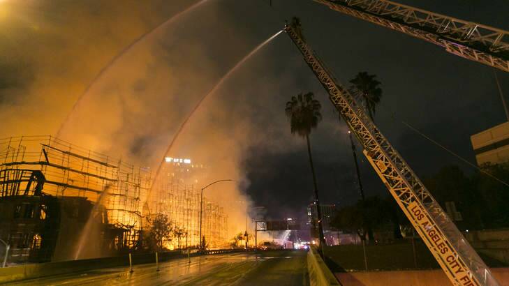 Authorities believe the building was empty at the time of the fire. Photo: Damian Dovarganes/AP