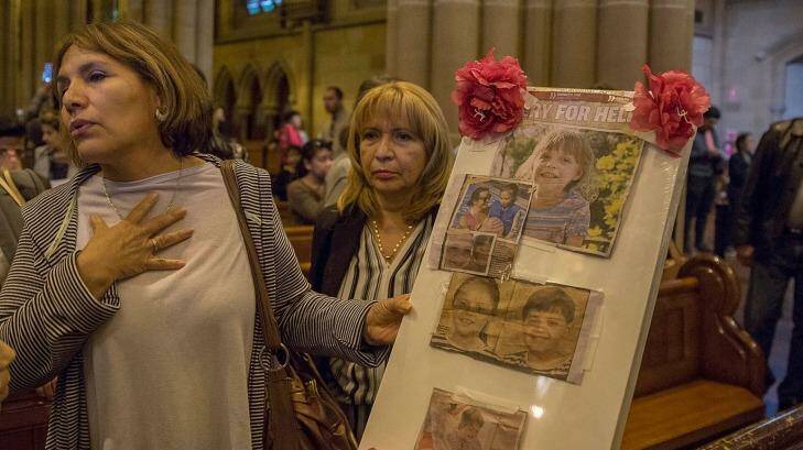 Social worker Isabella Almendrades with the tribute in St Mary's Cathedral.  Photo: Michele Mossop
