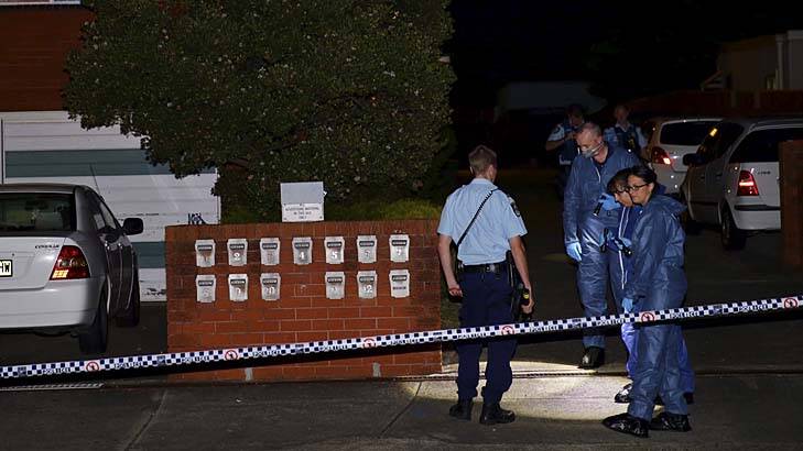 Police photograph the crime scene in Lakemba where a shooting occurred. Photo: Wolter Peeters