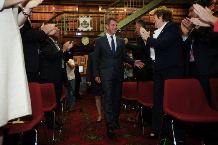 NSW Premier Mike Baird is congratulated as he enters a party room meeting of the NSW Liberal Party where the newly elected MP's were introduced. NSW Parliament, Sydney, NSW. 1st April, 2015. Photo: Kate Geraghty Photo: Kate Geraghty