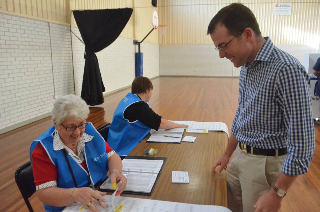 ROMPED IT IN: Northern Tablelands incumbent Adam Marshall, of the Nationals, collects his ballot papers at a polling booth in Moree on Saturday.