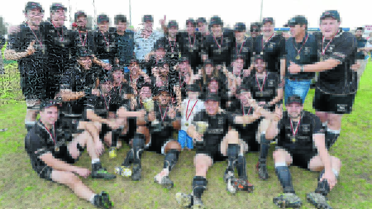 The Bulls celebrate back-to-back second grade grand final wins on Saturday. 	               Photo: Barry Smith