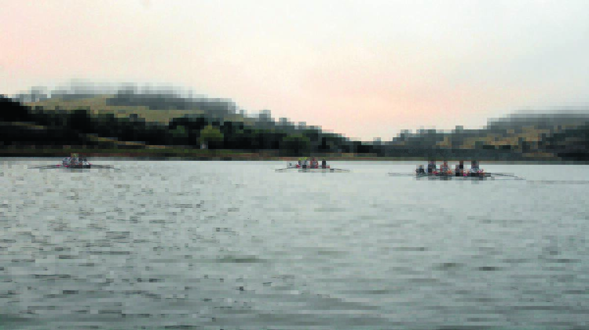 The three TAS crews hold their final training session on the water at Malpas Dam on Saturday in foggy conditions.