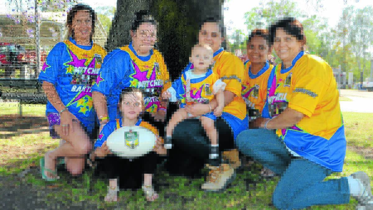 Keira Williams, Shay and Holly Bartram, Sheena Fernando and Tracey Bartram with Dakota Bateman and Cooper Townsend wearing the jerseys for the Mitchell Bartram Memorial rugby league match at Pallamallawa on Saturday.