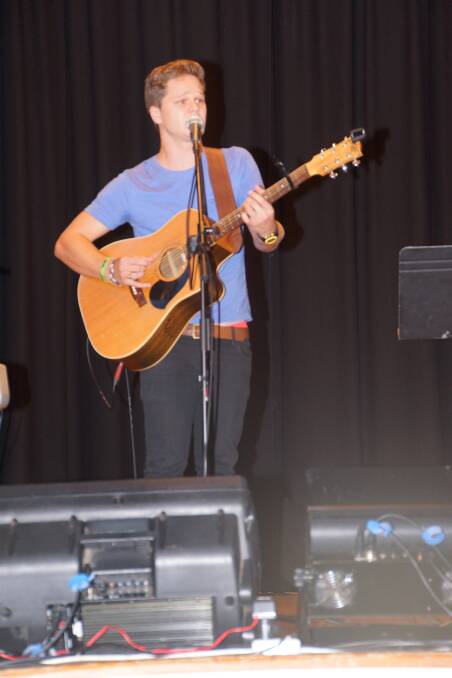 Warialda's Benny Nelson performs his new song 'Purple Heart' for the crowd. Benny is a previous Superstar junior winner, and scholarship recipient. He is currently working on the School Spectacular.