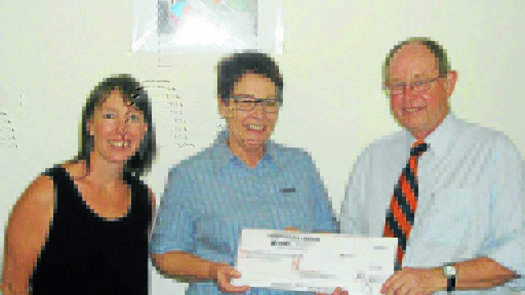 Rhodes Kildea Lawyers directors Sarah Osborn and Peter Gall present the $3000 cheque to Moree and District Health Service acute health service manager, Bronwyn Cosh.