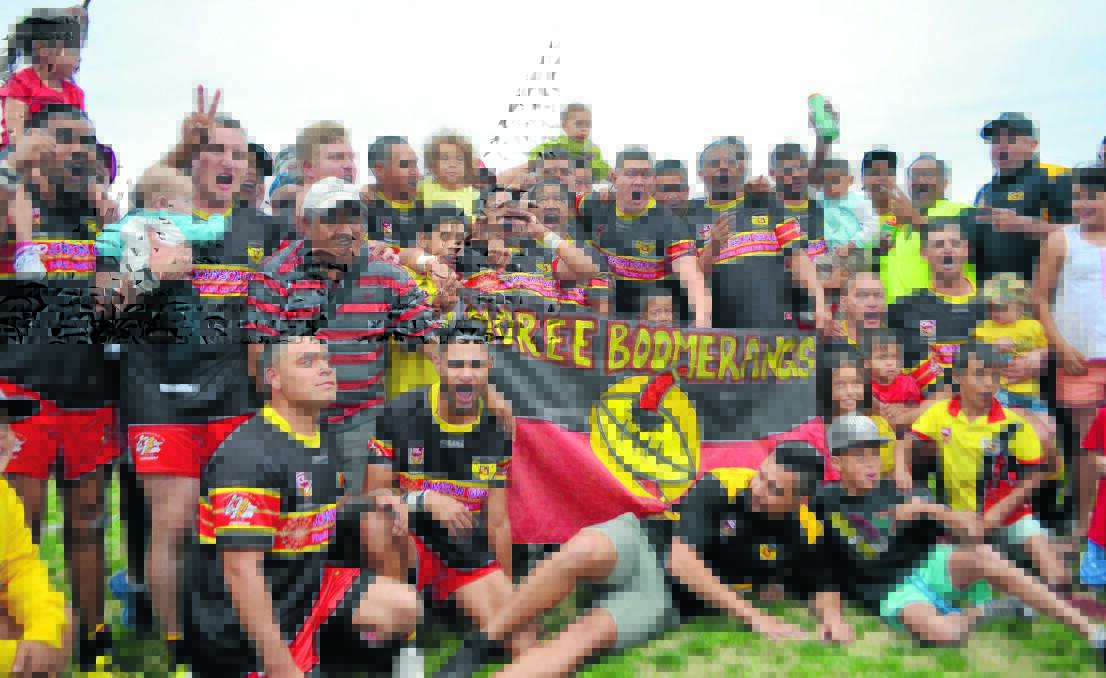 The Boomerangs first grade team celebrates back-to-back Group 19 premierships on Sunday.