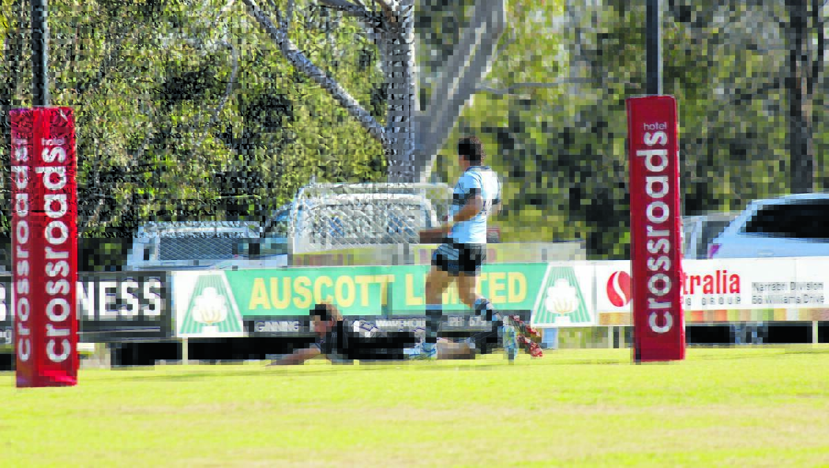 ON THE BOARD: Jordan Cosh scores the first try of the match for the Bulls, crossing the line in front of Narrabri’s Matthew Schwager.