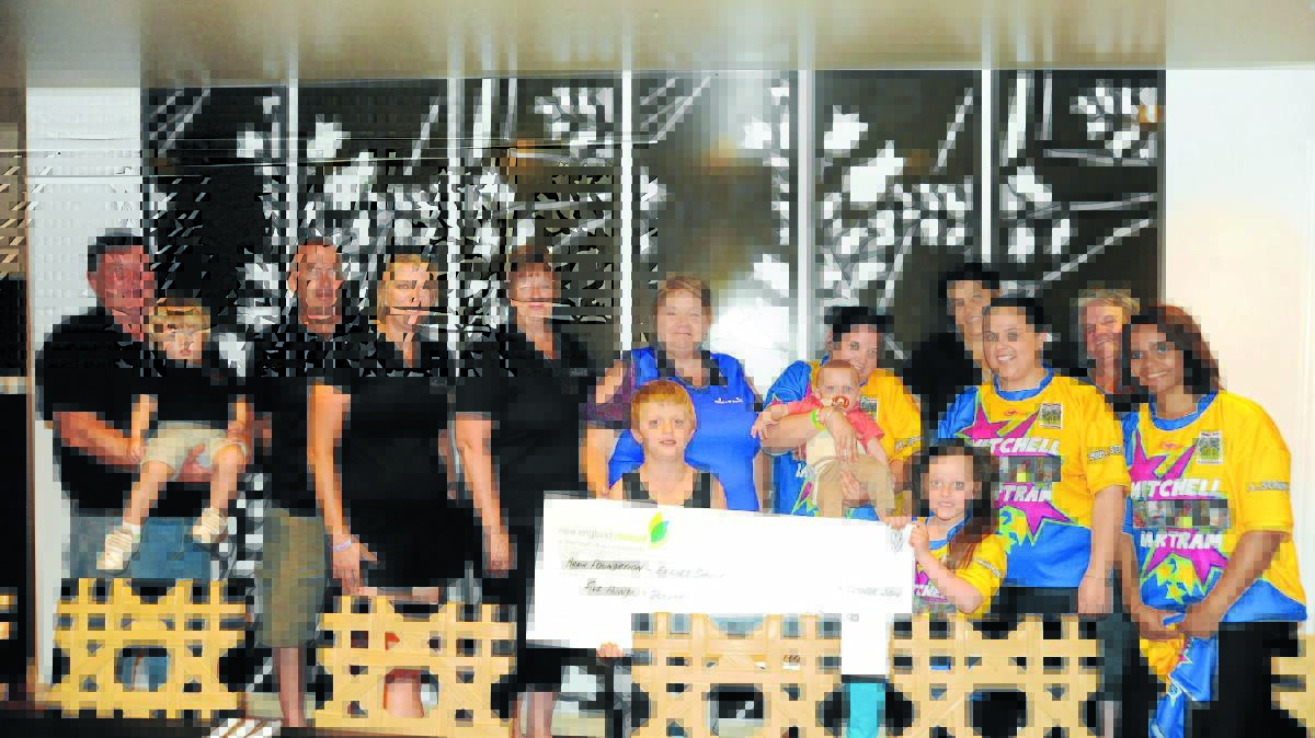 The Mitchell Bartram Trust hand over a cheque to the Ride for Ellie's Smile crew at Moree on Sunday evening.