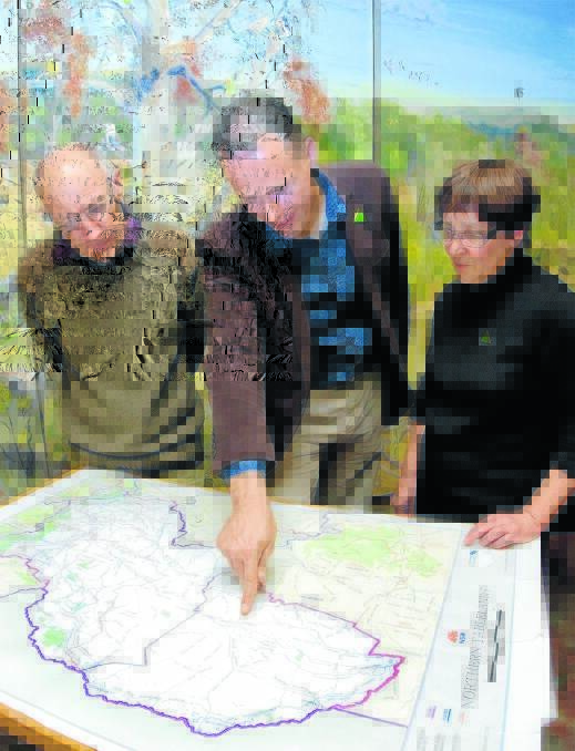 Greens candidate Mercurius Goldstein plans his next move in a new-look Northern Tablelands electorate with Chris Nadolny and Elizabeth O’Hara.       Photo: Tony Grant