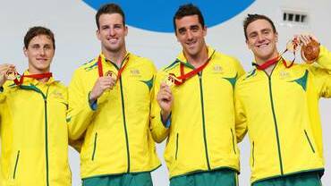 Cameron McEvoy, James Magnussen, Matt Abood and Tommaso D'Orsogna of Australia pose with their gold medals during the medal ceremony for the Men's 4 x 100m Freestyle Relay Final. Photo: GETTY IMAGES