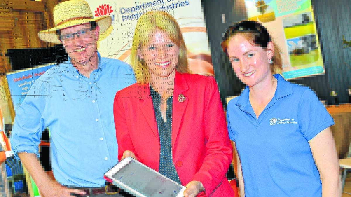 NSW Minister for Primary Industries, Katrina Hodgkinson, with Orange MP, Andrew Gee, and Department of Primary Industries beef development officer, Patricia O’Keeffe, launching the new Drought Feed Calculator app at the Australian National Field Days near Orange.