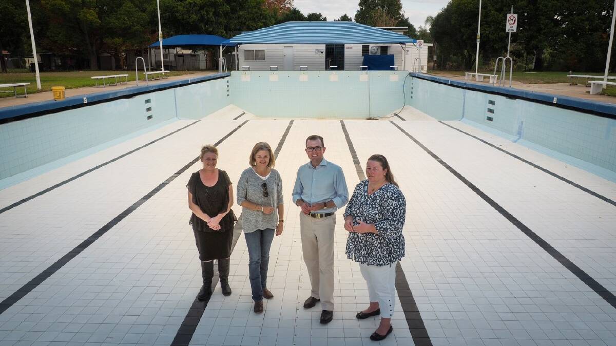 Bingara Swimming Club Vice President Bez Dixon, left, President Nicole Dixon, Northern Tablelands MP Adam Marshall and club secretary Fiona Rattray in the Bingara town pool, which has been drained for winter.