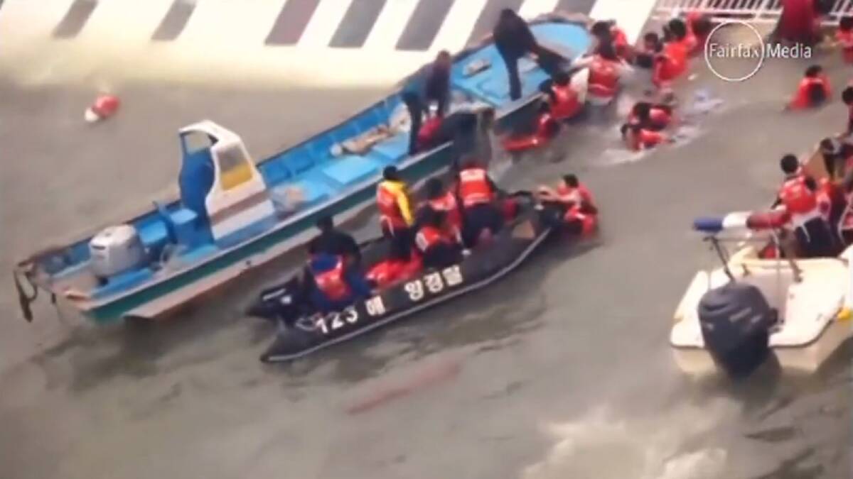 South Korean Coast Guard video shows the capsized ferry off South Korea and members of the country's coast guard rescuing survivors.