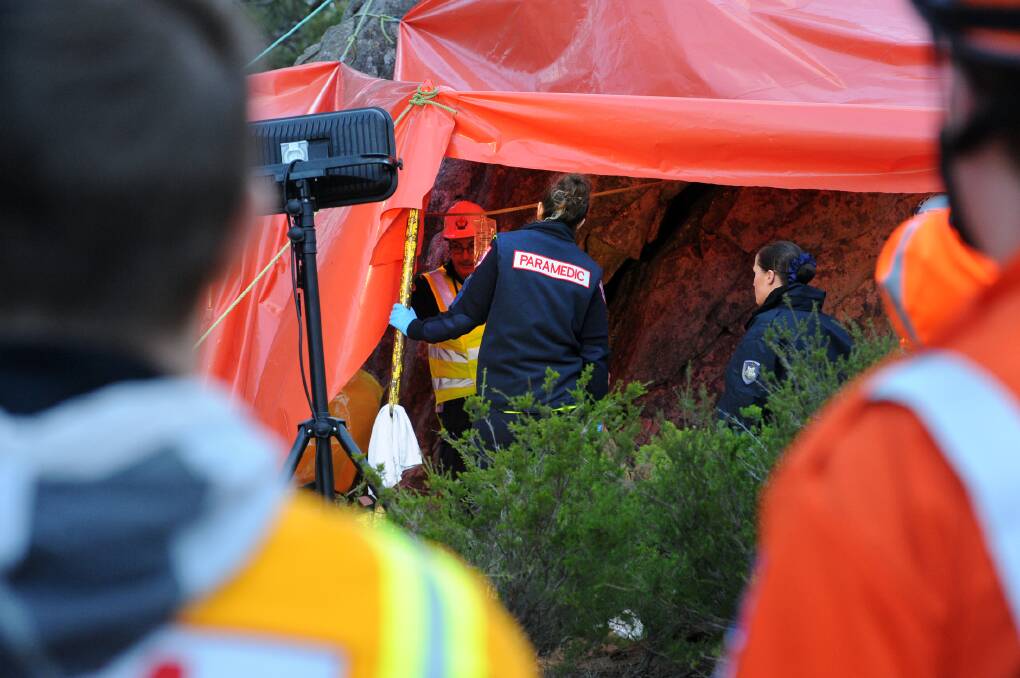 ACTION: Dramatic rescue unfolds at Mt Arapiles. A Man, 24, trapped while negotiating the Mt Arapiles squeeze test. Pictures: PAUL CARRACHER