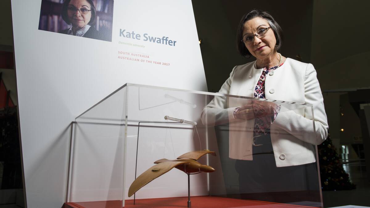 Kate Swaffer, dementia advocate and South Australia's 2017 Australian of the Year, with her wooden seagull at the National Museum of Australia's exhibition. Each of the eight finalists has chosen an object with which they have a deep personal connection and has shared the story behind that object. Photo: Elesa Kurtz